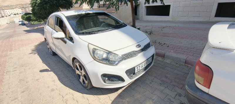 كيا ريو 2015 هاتشباك أبيض للبيع في دمشق بسعر 10500$